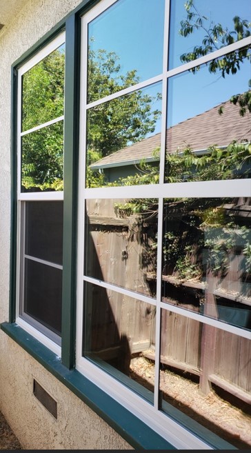 Milgard Trinsic Series window with Simulated Divided Lites (SDLs) shown in a white vinyl frame.